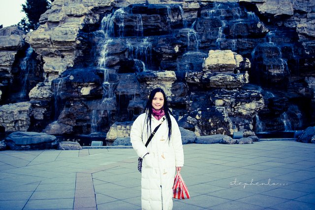 Melissa at a manmade waterfall in DaTang Paradise